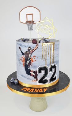 a birthday cake decorated with an image of a basketball player and the number 22 on it