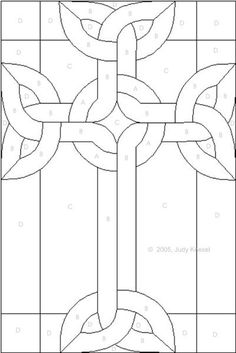 an image of a stained glass window with a cross in the center and leaves on it