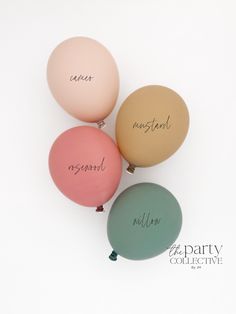 three balloons with names on them sitting next to each other in front of a white background