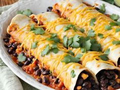 an enchilada dish with black beans and cilantro