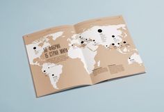 an open brochure showing the location of different places in the world on it