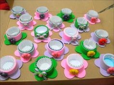 there are many hats on the table and one is made out of cupcake liners