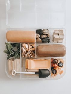 a plastic container filled with lots of different types of soaps and other things in it