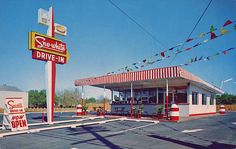 an old photo of a drive in restaurant