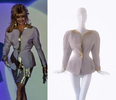 Fabulous rare Thierry Mugler Jacket. Documented SS 1992 Collection. Light grey with metallic gold coloured details. Closes with one press button at the wast. Sculptural Thierry Mugler creation with fitted waist and deep sexy V-neck. #thierrymugler #mugler #couture #90s Mugler Jackets Tailoring, Thierry Mugler Leather Jacket, Vintage Mugler Gold, Vintage Mugler Jacket, Custom Mugler, Mugler 2020, Mugler Spring 1997 Couture, Mugler 90s, Mugler Couture