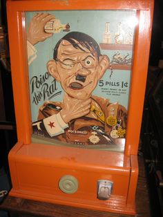 an old fashioned machine with a cartoon character on it's front and side panel