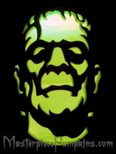 an image of a man's face in the dark with green light on it