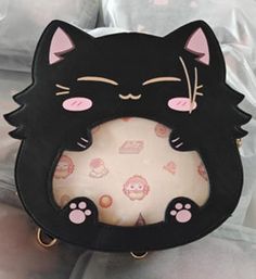 "PREORDERS FOR BLACK GETOCAT BAG ARE OPEN ON MY STORE yulicechan.com An itabag featuring everyone's favorite cat with bangs! This ita bag is made with pu leather as well as cotton insides for a sturdy exterior and a soft interior. It comes with one main storage compartment as well as 4 internal pockets: one large padded pocket, two smaller open pockets, and one zipper pocket. Itabag Size: 9\" x 9\" x 3\" (14\" total with tail and ears) The ita bag includes: - 1 Removable tail - 1 Crossbody strap Cat Design Crossbody Travel Bag, Kawaii Cat Design Tote Bag, Harajuku School Bag With Cat Design, Kawaii Cat Design Shoulder Bag For Daily Use, Kawaii Tote Bag With Cat Design, Black Cat Design Shoulder Bag For School, Cute Black Portable Bag, Kawaii Black Satchel Shoulder Bag, Kawaii Shoulder Bag With Cat Design For Daily Use