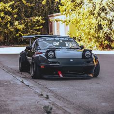 a black sports car parked on the street