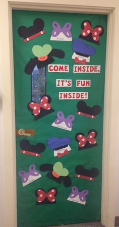 a door decorated with mickey mouse ears and the words come inside it's fun inside