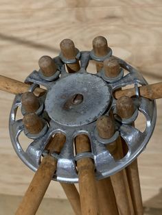 a metal object with wooden handles on it