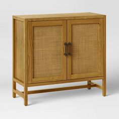 a wooden cabinet with two doors on the front and one door open to reveal it's natural wood frame