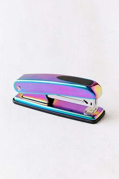 a multicolored metal case with a stapler on the front and back side