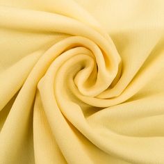 a close up view of a yellow fabric