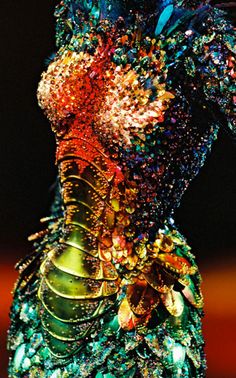 a dress made out of many different colored objects