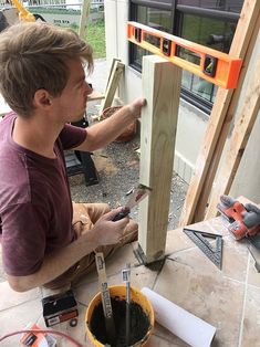 a man is working on some wood