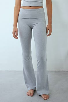 Out From Under lounge pant in a soft & stretchy jersey knit designed to be an everyday favorite. Cut in a flare silhouette featuring a low-rise and wide foldover waistline for a throwback vibe. Exclusively at Urban Outfitters. Features Out From Under Bec foldover flare pant Low rise lounge pant Soft and stretchy jersey knit Low rise foldover waistline Fitted through waist, hips and thighs Slim flare fit Full length Pull-on construction UO exclusive Content + Care 95% Cotton, 5% spandex Machine wash Imported Size + Fit Model in Black is 5’8" and wearing size Small Measurements taken from size Small Waist: 26" Inseam: 32" | Out From Under Bec Foldover Flare Pant in Light Grey, Women's at Urban Outfitters Outfit Wishlist, Grey Yoga Pants, Identity Crisis, Spring Break Outfit, Aerie Pants, Flare Pant, Shopping Clothes, Comfy Pants, Flare Leggings