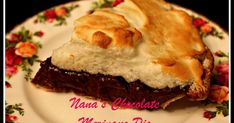 a piece of chocolate meringue pie on a floral plate with the words nana's chocolate mince pie