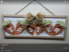 a wooden sign that says easter hanging from a string with burlap and twine