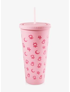 a pink cup with symbols on it and a straw sticking out of the top one