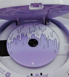 an electronic device with purple paint on it