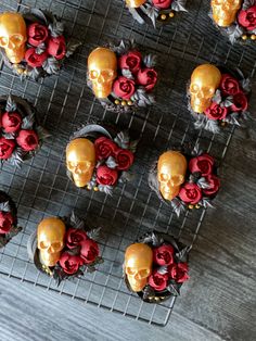 cupcakes decorated with red and gold sugar skulls