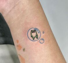 a small dog in a bubble tattoo on the left arm and right arm, with bubbles coming out of it