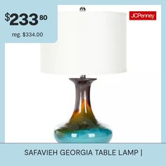 a table lamp with a price tag for $ 23 99 reg $ 34 00 and the sale is on