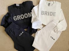 three matching bride and groom sweatshirts on the floor