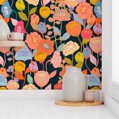 the wallpaper is colorful and has flowers on it