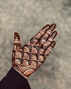 a person's hand with henna on it