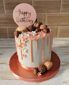 a birthday cake with frosting and candies on top