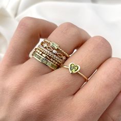 Ashly Follow your heart, and it will lead you to our gold rings. This beautiful ring has the prettiest heart shape cut and would make the perfect gift for her. Available in Yellow Gold, White Gold, and Rose Gold. - Handmade- Solid Gold- Natural Peridot- Total Peridot Carat Weight: 0.52 ctw- Bezel Setting Size: 7.5 mm- Ring Band: 1.4 mm All pieces come beautifully boxed in suede pouches you can always use when traveling! Vibrant Energy, Peridot Ring, Follow Your Heart, Baguette Cut, Beautiful Ring, Gold Texture, Ring Band, Perfect Gift For Her, Lush Green