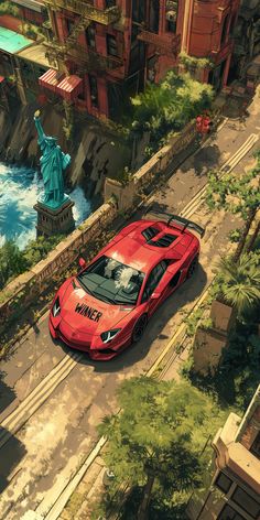 a red sports car parked in front of the statue of liberty