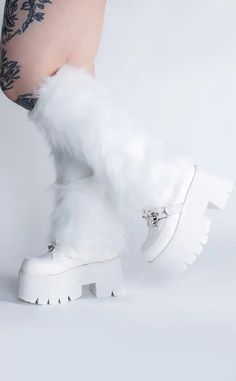 Snow fox given when you're wearing these fluffy white leg warmers.These white fluffy leg warmers are hotter than hell, and they'll keep you warm too. Wear these gorgeous furry white leg warmers to festivals, raves, or even as a winter wardrobe essential. Paired these leg warmers with your favourite goth boot and platform heels for a punch of spice to any outfit! Measurements: 40cm length, 20cm widthComposition: 100% AcrylicFit: Tight around calves Care Instructions: Hand wash, do not dry clean. Can fluff up with a hair brush Fluffy Leg Warmers, White Leg Warmers, Fox White, Goth Boots, Winter Wardrobe Essentials, Concert Looks, White Boots, Black Heart, Socks And Hosiery