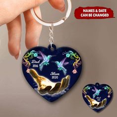 a heart shaped keychain with two doves on it and the words date to be changed