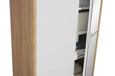 an open cabinet with white drawers and wooden doors