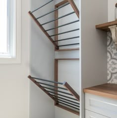 the stairs in this kitchen are made from wood and metal