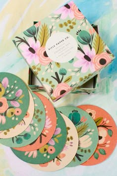 six coasters with floral designs on them