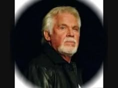 an older man with white hair and a leather jacket