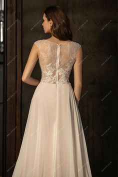 a woman in a wedding dress looking back