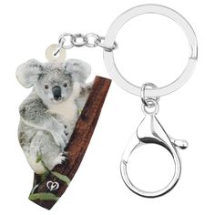 a keychain with a koala on it's front and back sides