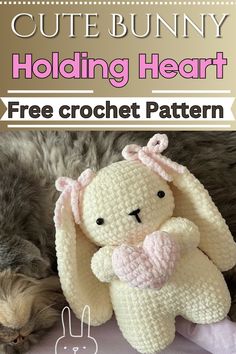 a crocheted bunny laying next to a cat with the text, cute bunny holding heart free crochet pattern