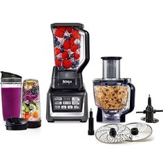 a blender filled with lots of food next to other items on a white surface