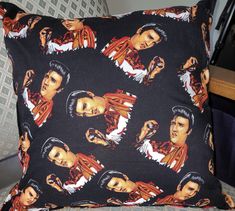 a black pillow with elvis presley on it