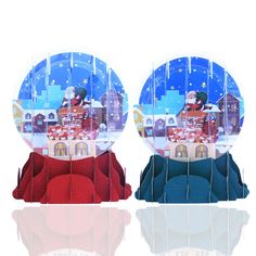 two snow globes sitting on top of each other