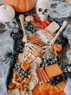 a table topped with lots of halloween food