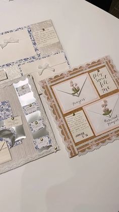 the table is covered with different types of cards and envelopes, including one that has been cut out