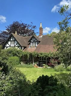 a large house surrounded by trees and bushes