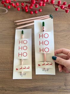 two paper tags with the words ho hoo and santa's sleigh on them